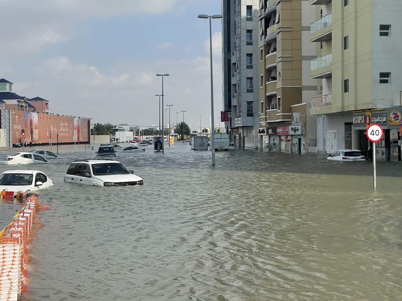 Cars stranded in flooded waters.