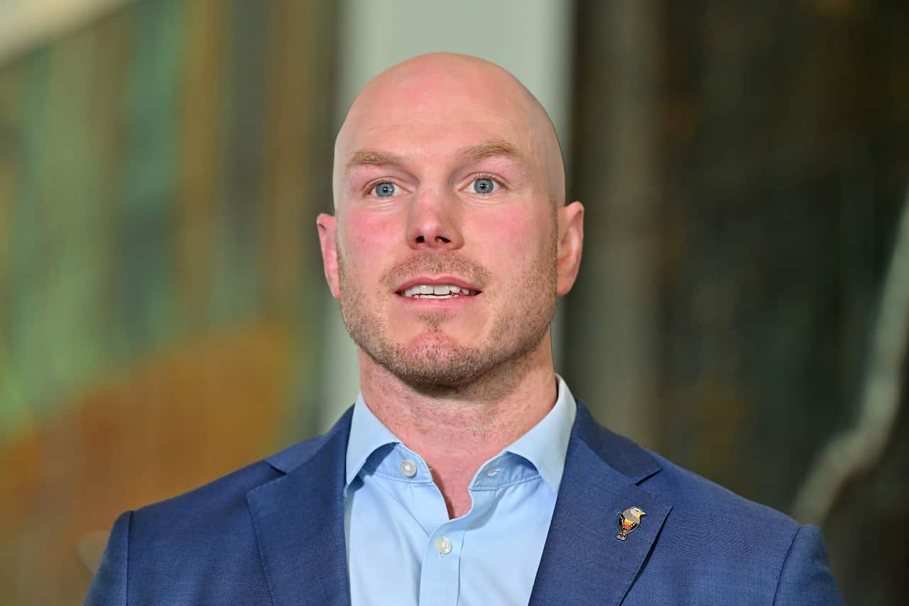 A man in a blue suit jacket and shirt