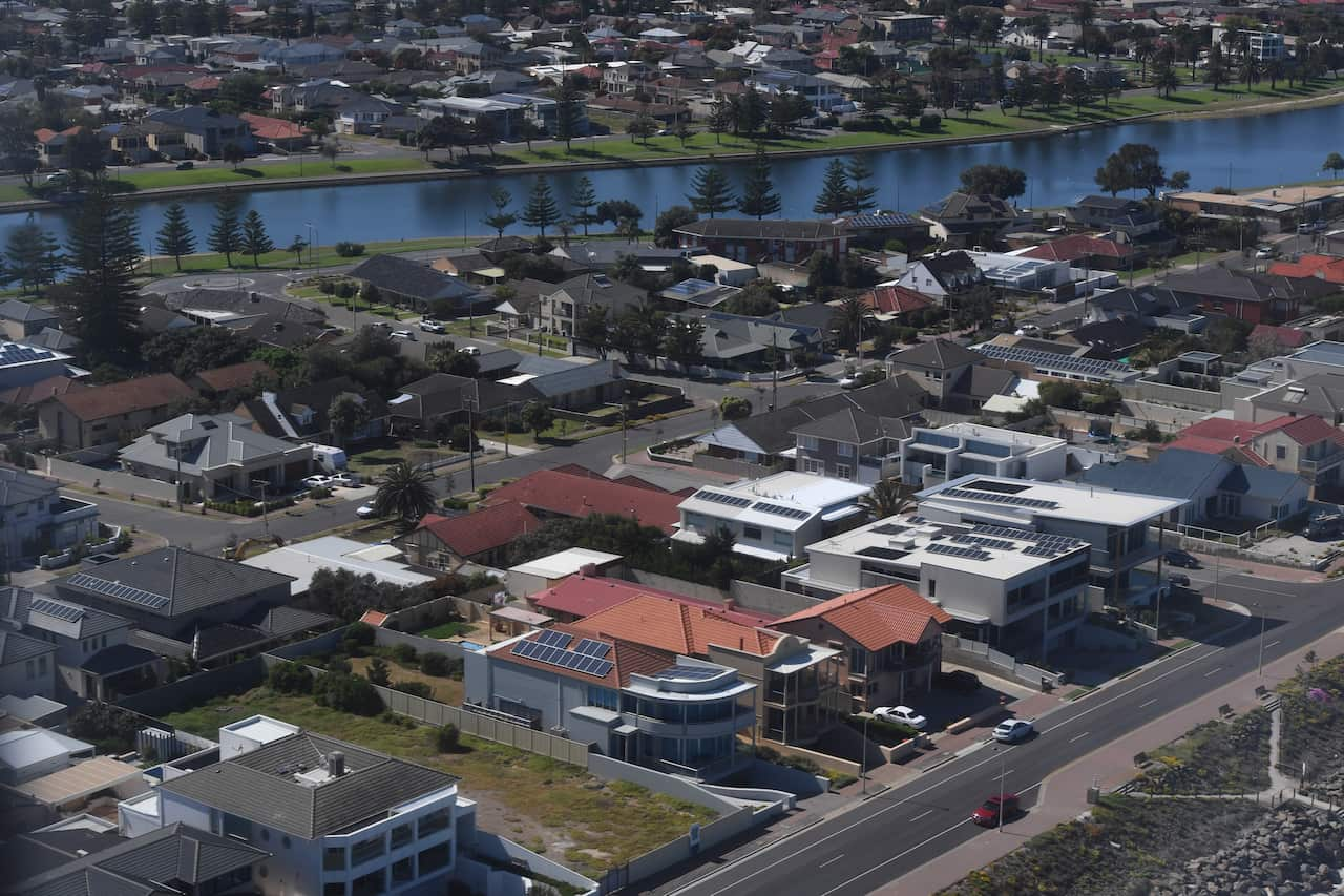 An aerial photo of buildings near a river.