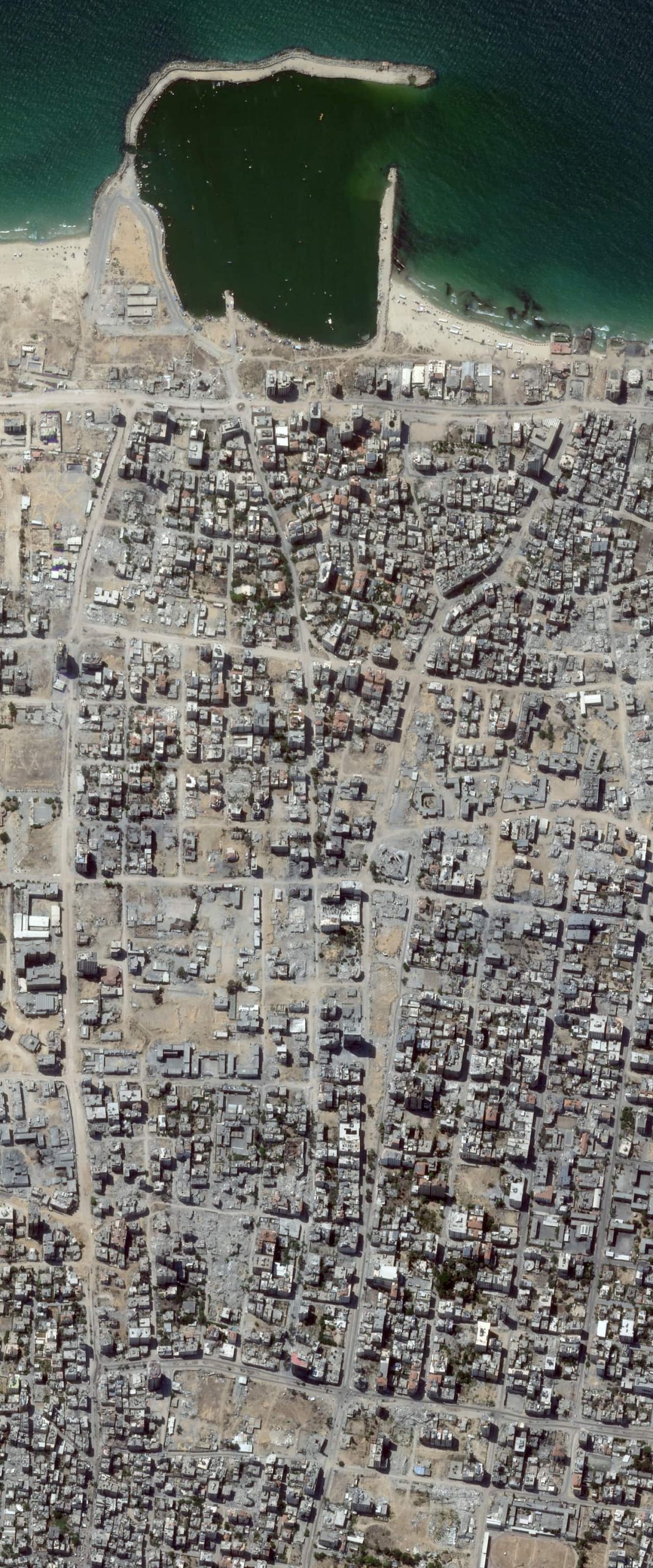 A satellite image showing destruction around the port of Gaza.