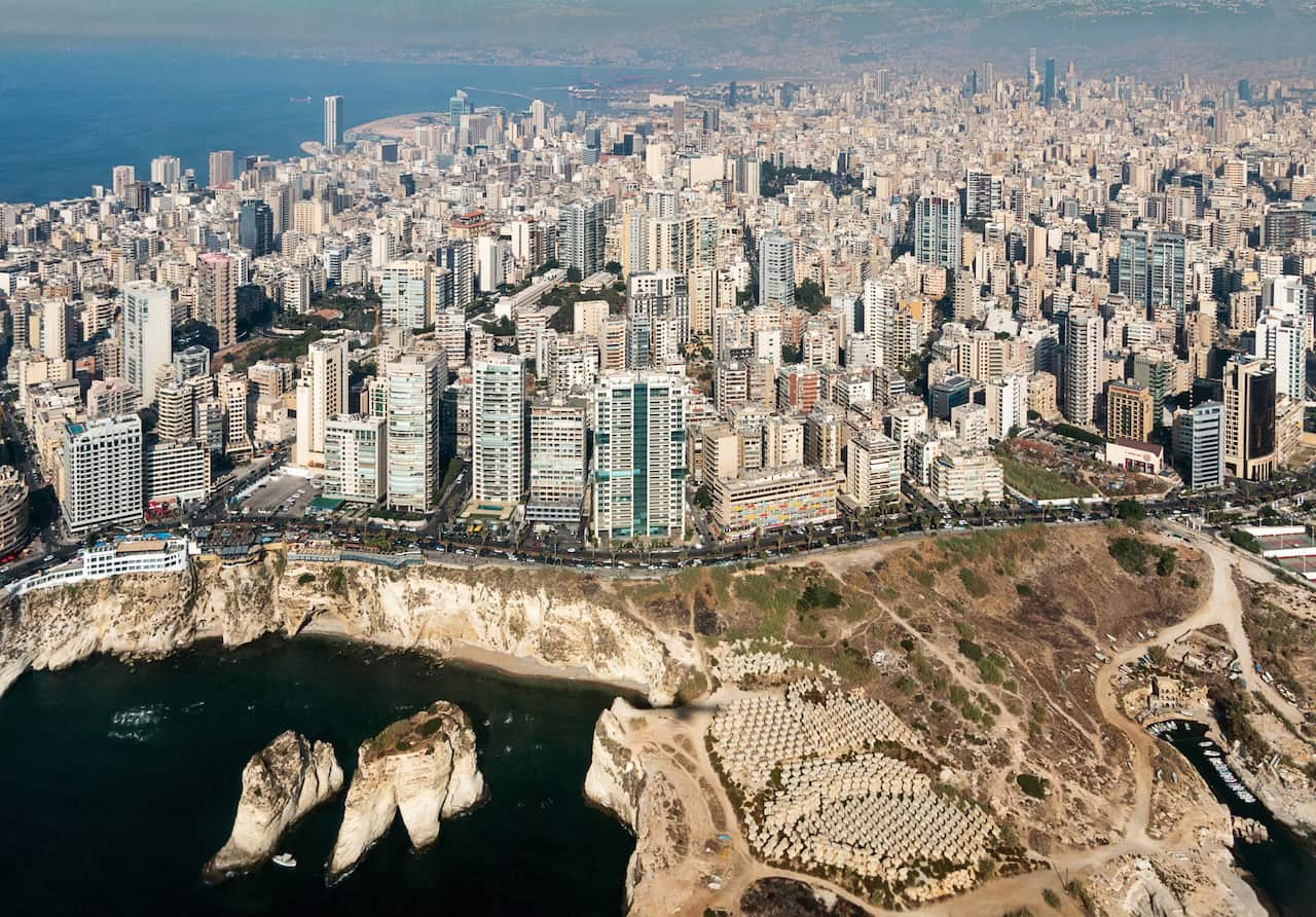 Aerial view of a big city on the edge of the sea.