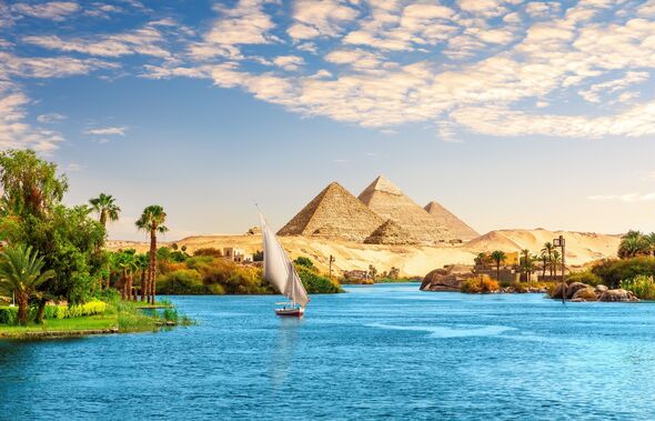 Beautiful Nile scenery with sailboat in the Nile on the way to pyramids, Aswan, Egypt