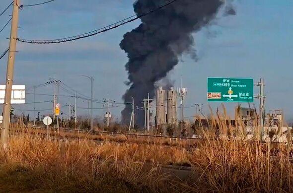 Smoke rises from the crash site