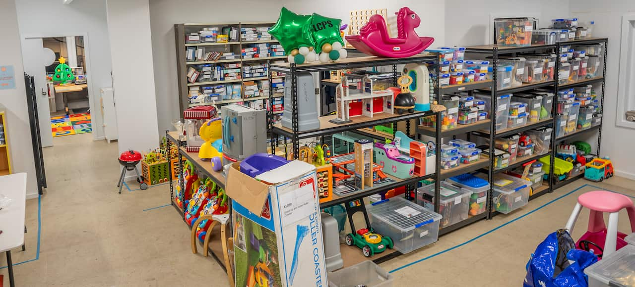 A room with shelves full of toys 