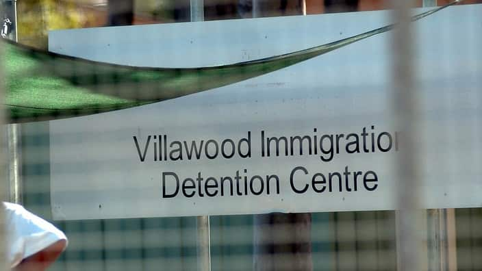 A sign that reads Villawood Immigration Detention Centre.