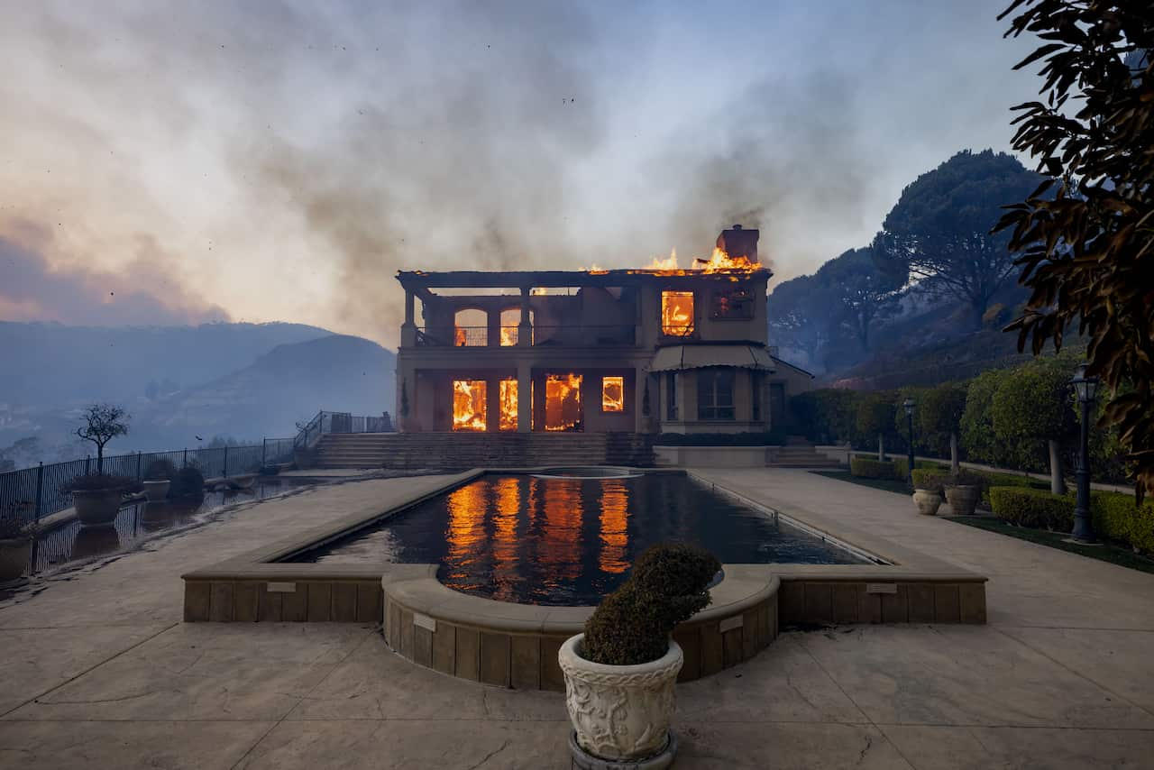 A large mansion on fire 