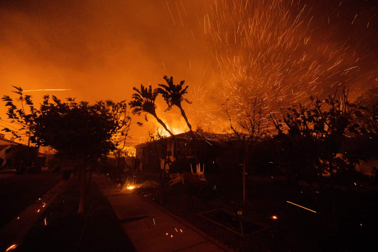 An image of fire sparks and large fires in the background