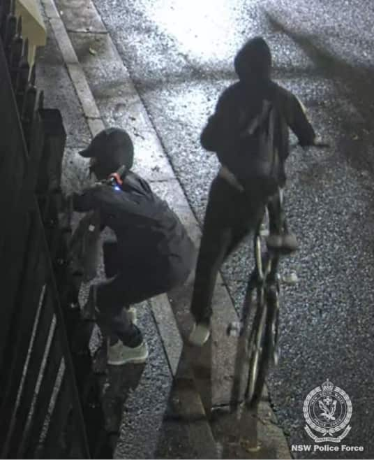 CCTV images of two people in hoodies