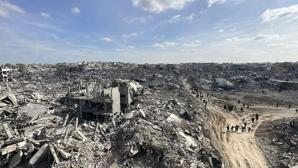 A view of destruction overlooking a refugee camp.